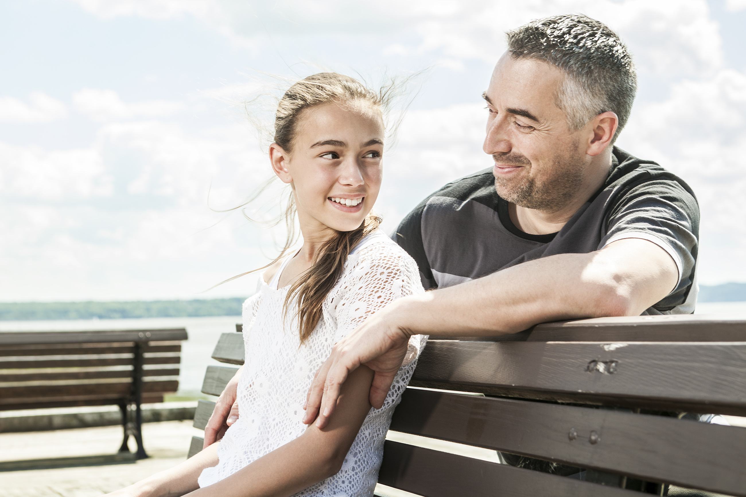 dad smiling with daughter