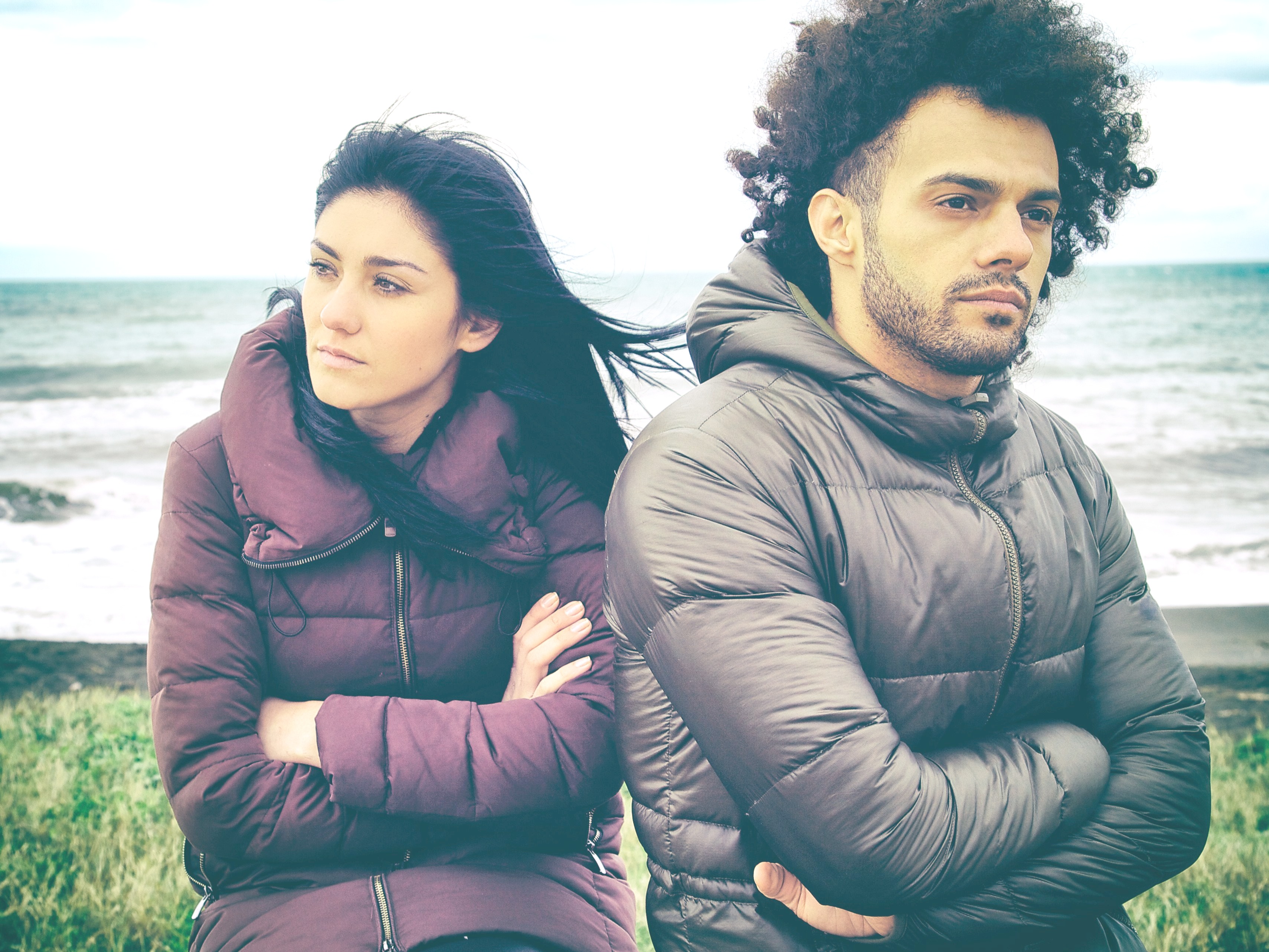 frustrated and confused couple on a beach