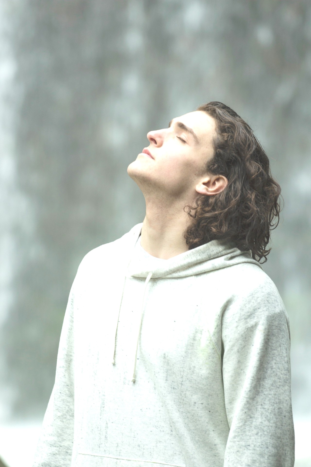 man feeling relief basking in sunlight