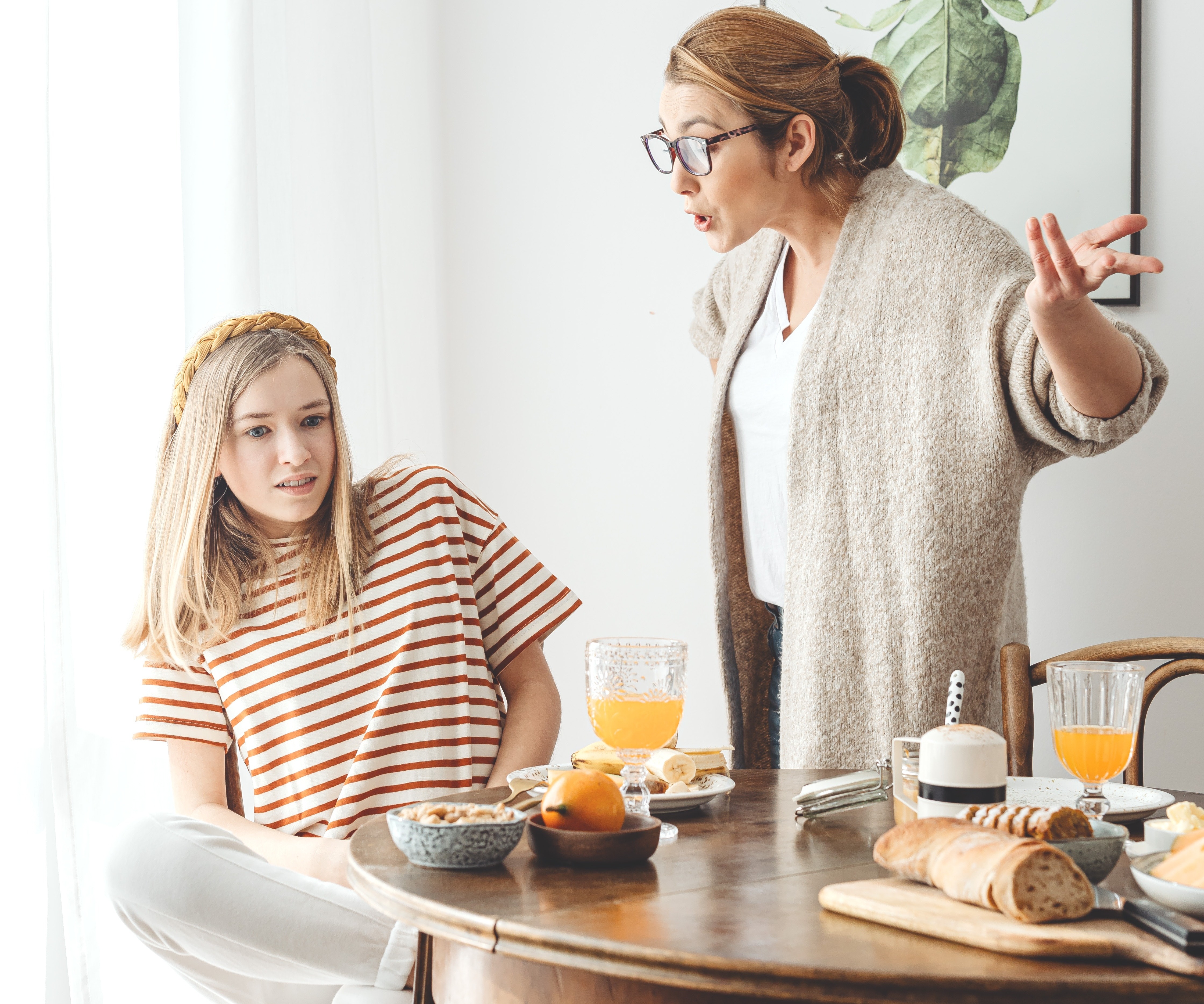 mother yelling at annoyed daughter
