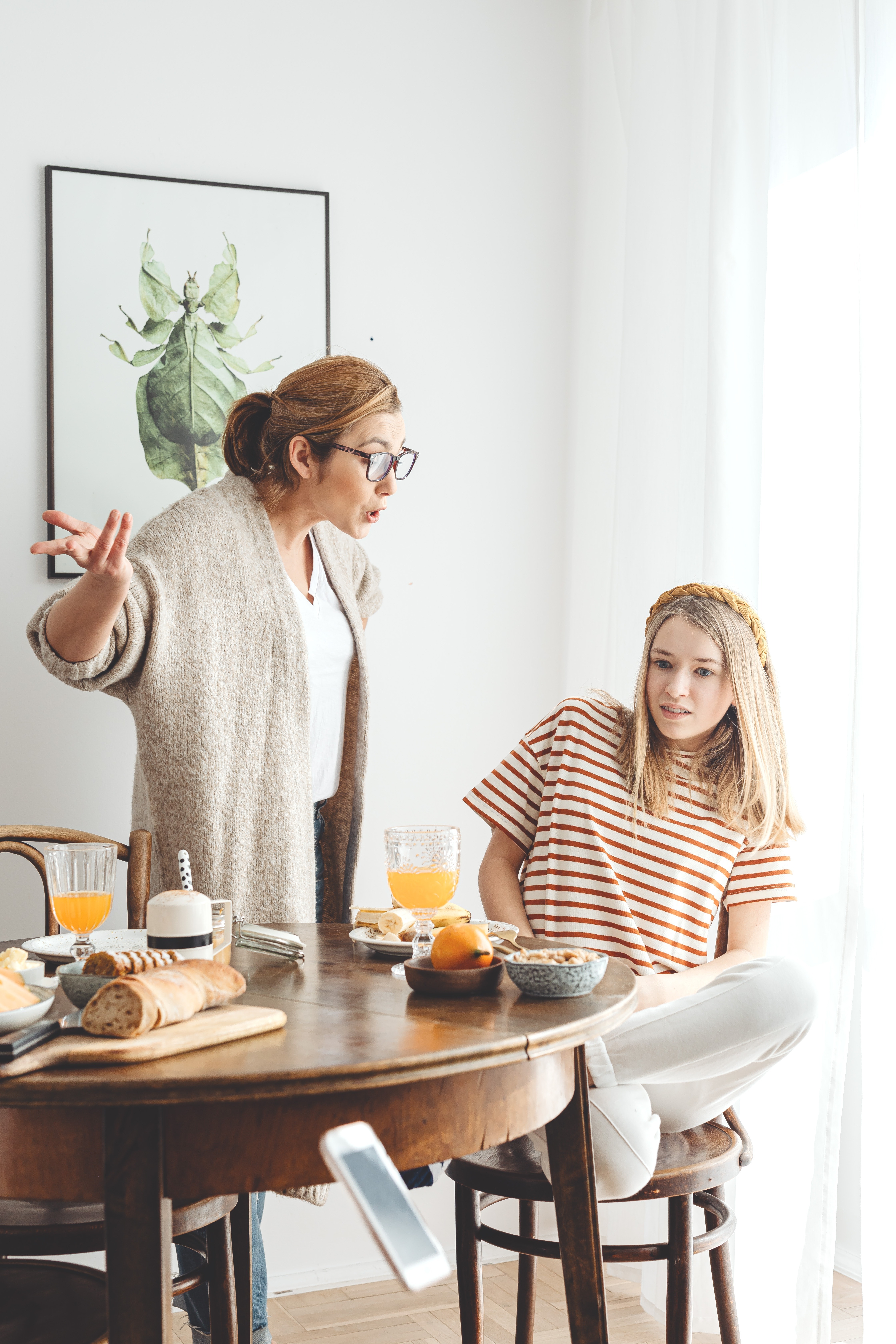 mother yelling at annoyed daughter