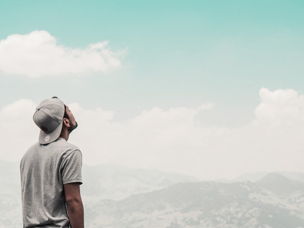 man looking up to sky