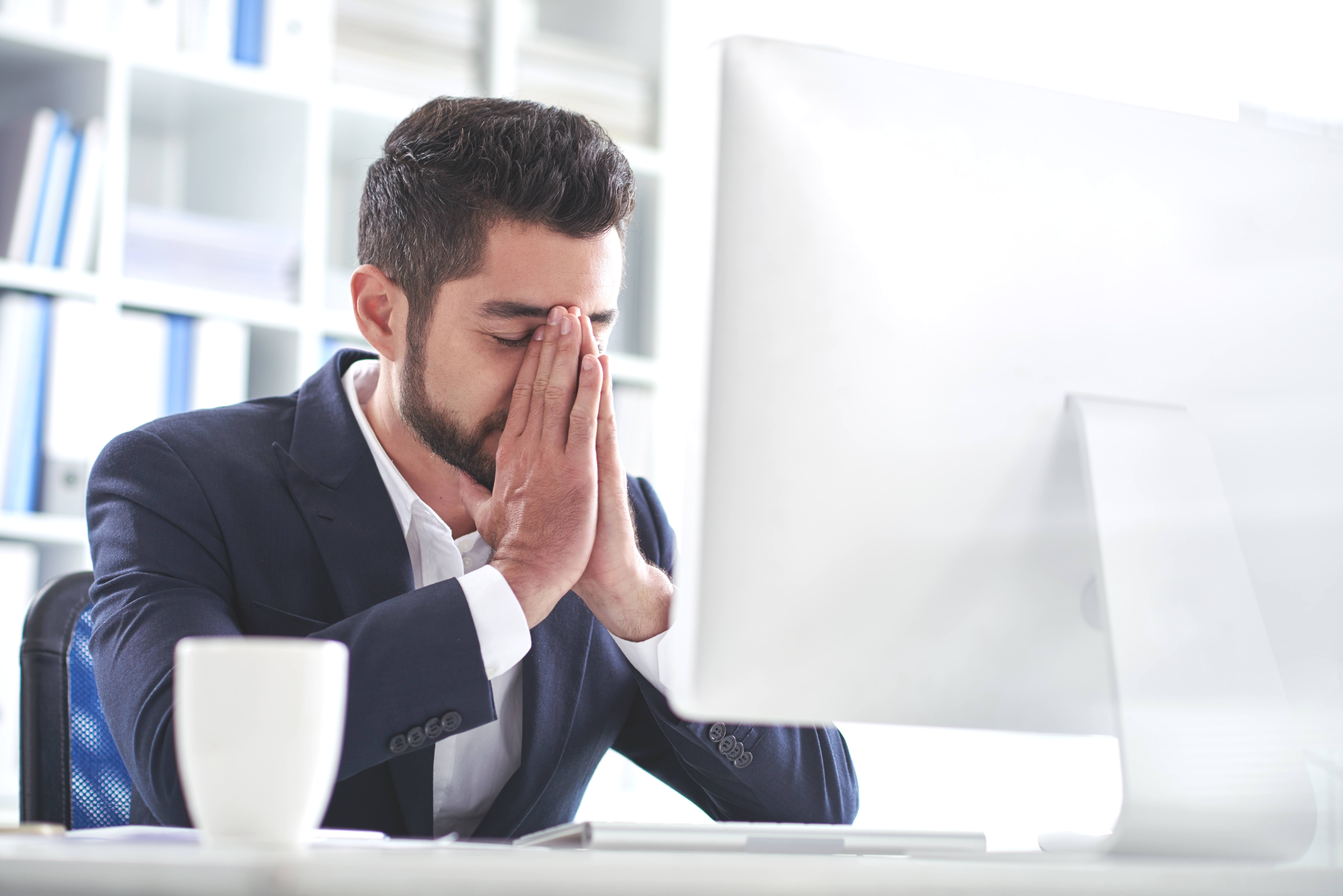 frustrated  man in front of computer