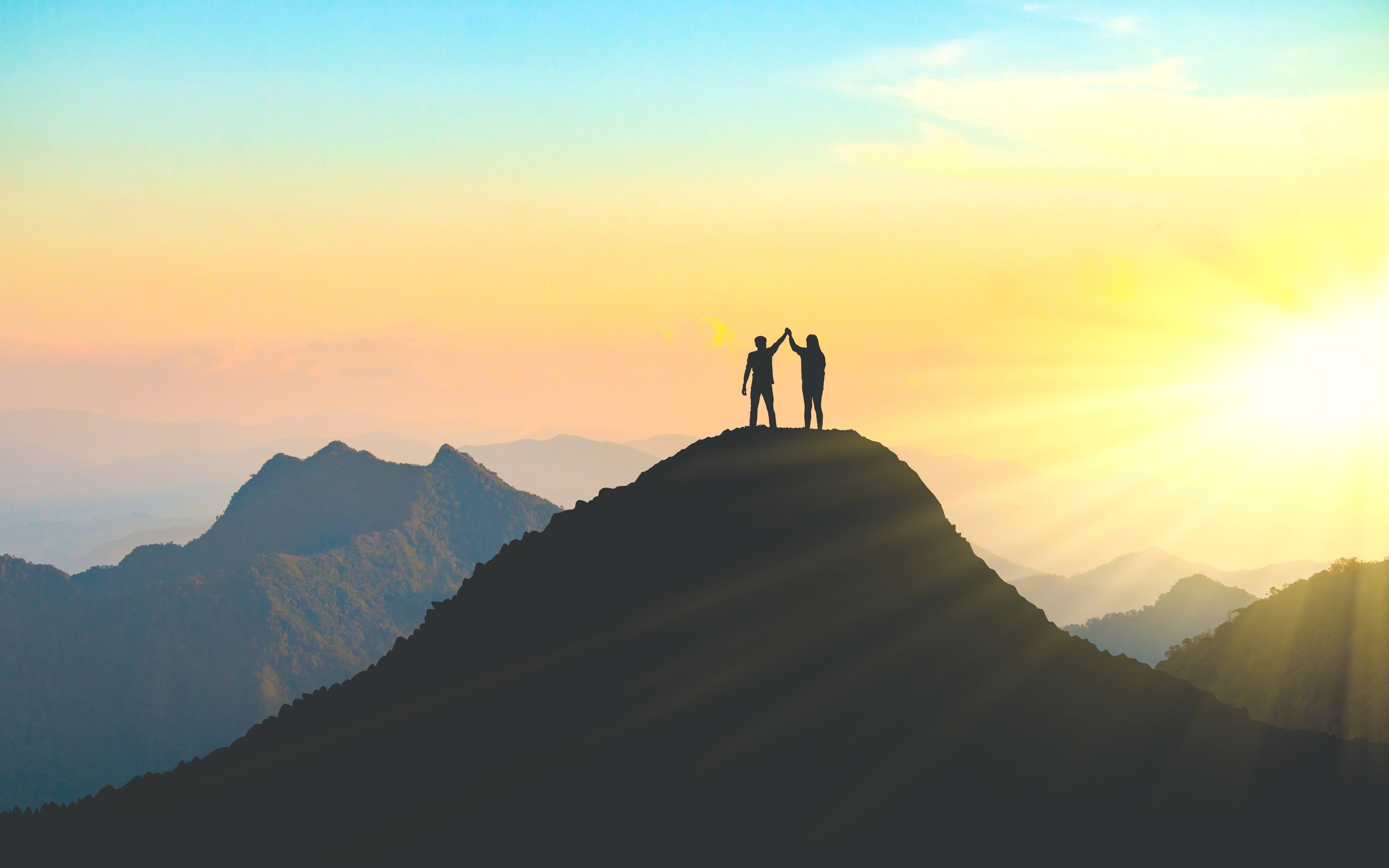 couple on mountain peak